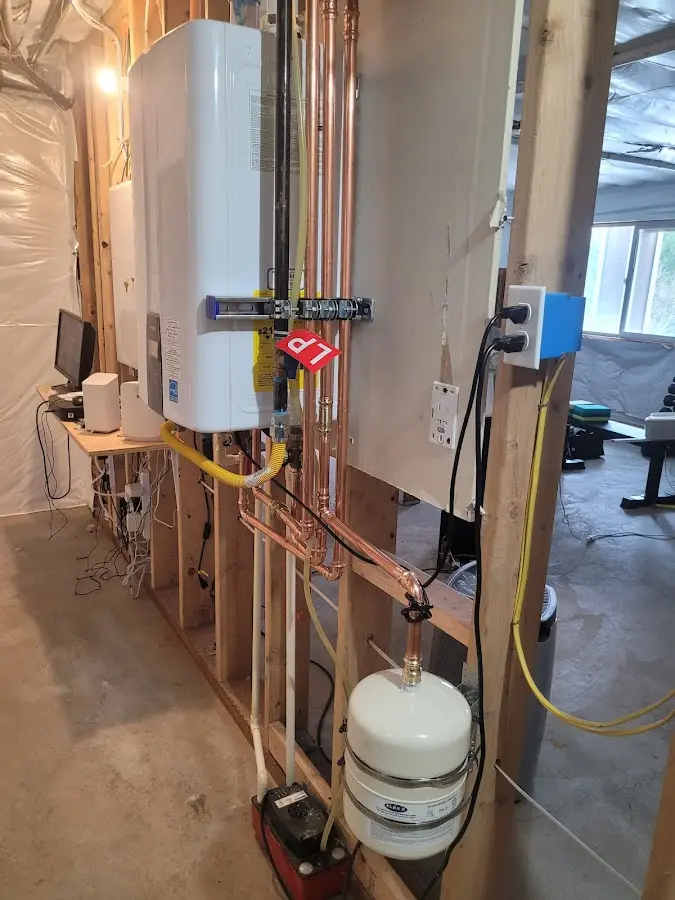 Licensed plumber repairing a kitchen sink in Silverdale
